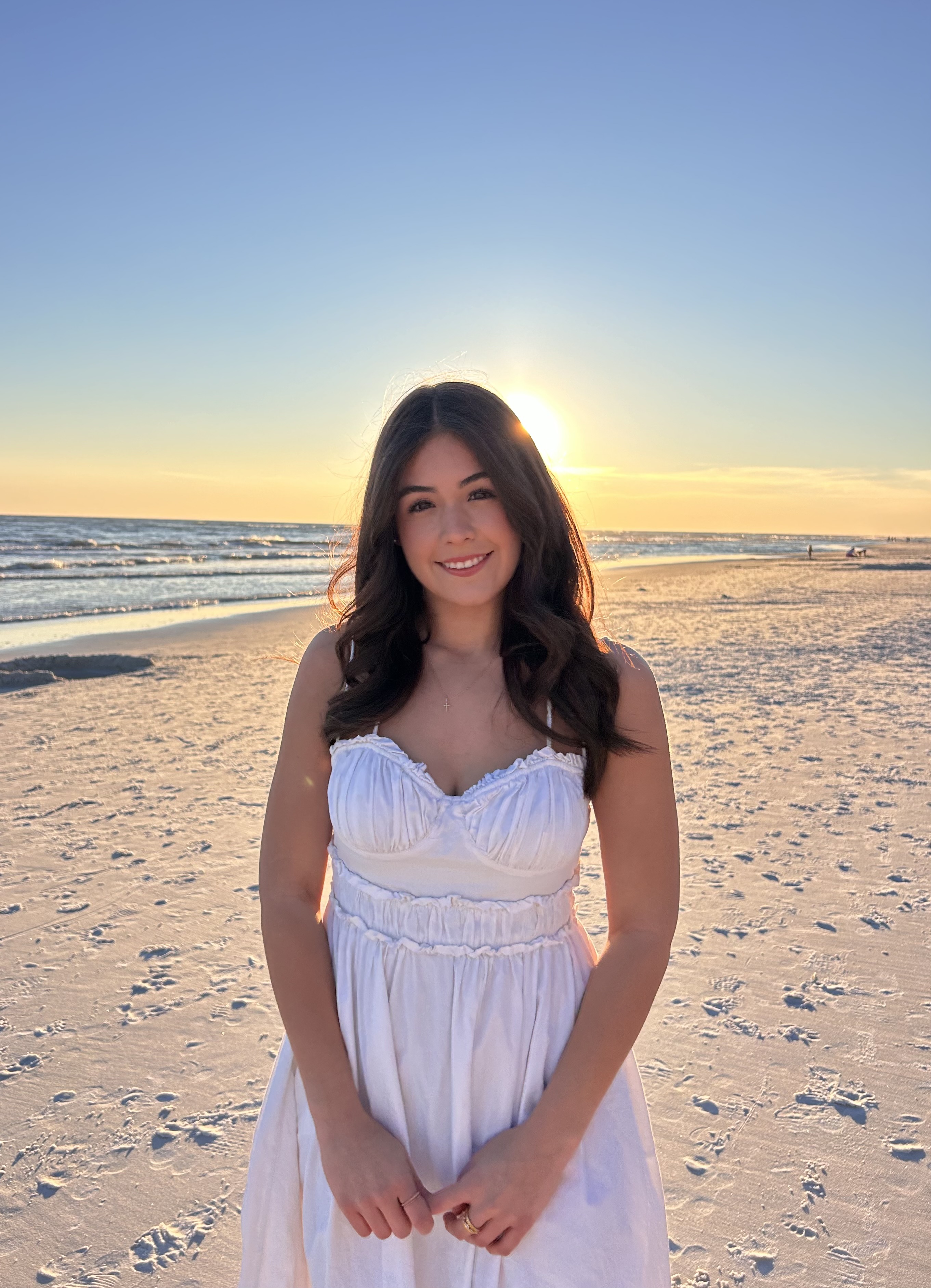 Sofie smiling on the beach